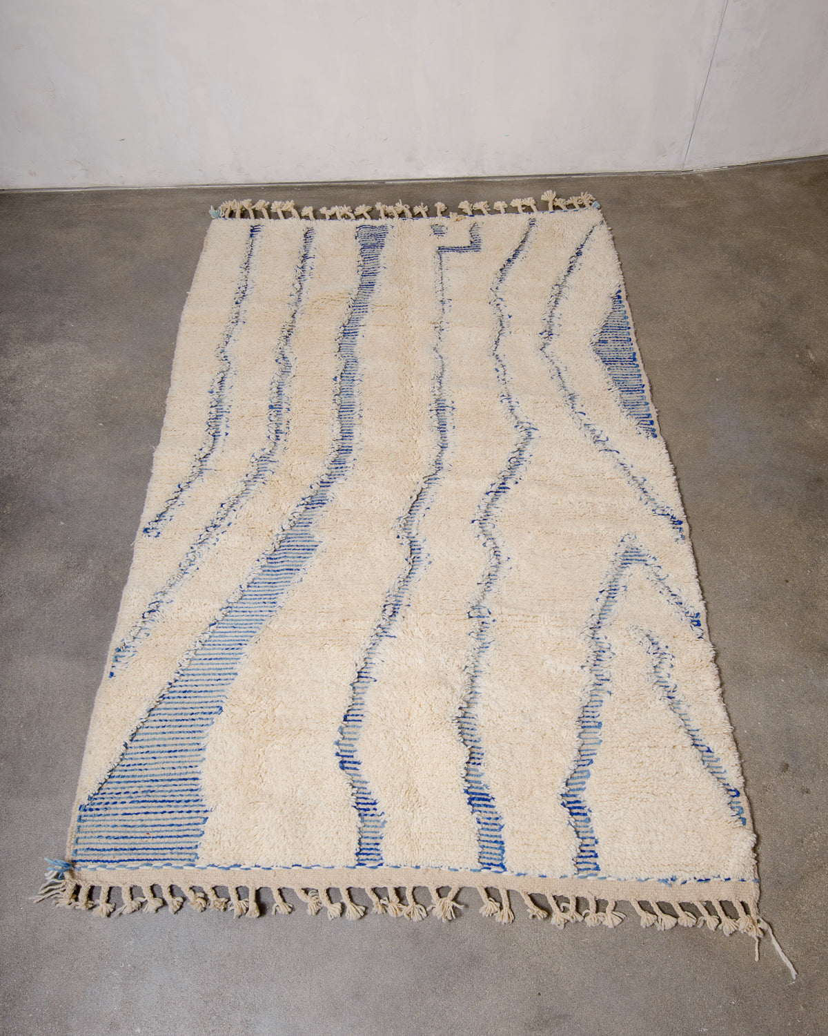 Modern, designer, handcrafted Berber rug from Morocco. Beniourain carpet with minimalist design, natural wool pile and a fluffy texture.